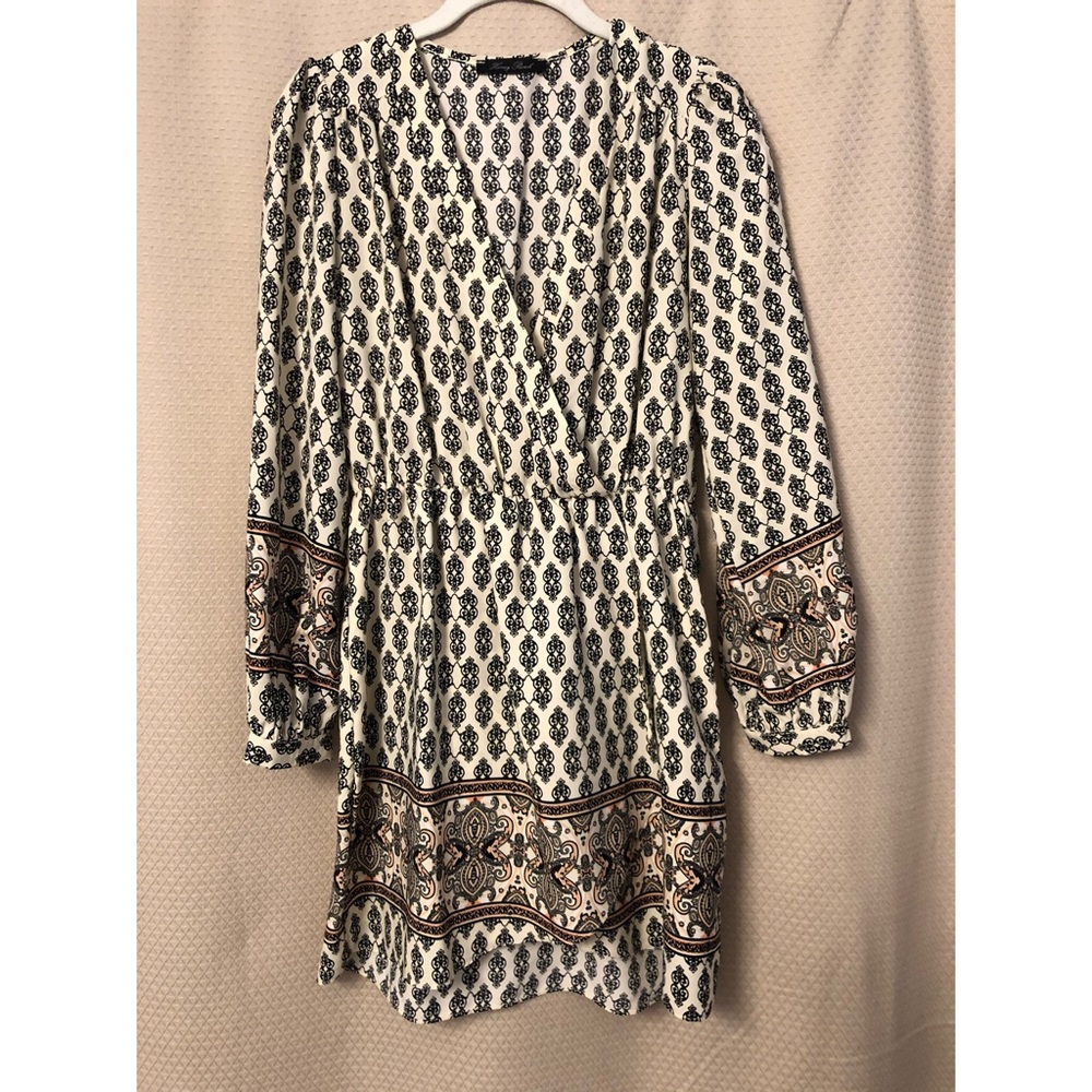 Black and cream pattern faux-wrap dress